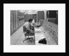 1960s 1970s Computer Room Mission Control Center Houston Texas 2 Men Sitting At Console by Anonymous