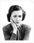 1940s Worried Woman Frowning Holding Hand To Cheek by Anonymous