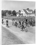 1950s 8 Kids Boys and Girls Ride Bicycles On Country Rural Road Lane Fun House In Background by Anonymous