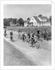1950s 8 Kids Boys and Girls Ride Bicycles On Country Rural Road Lane Fun House In Background by Anonymous