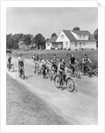 1950s 8 Kids Boys and Girls Ride Bicycles On Country Rural Road Lane Fun House In Background by Anonymous