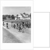 1950s 8 Kids Boys and Girls Ride Bicycles On Country Rural Road Lane Fun House In Background by Anonymous