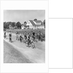 1950s 8 Kids Boys and Girls Ride Bicycles On Country Rural Road Lane Fun House In Background by Anonymous