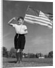 1940s Boy Holding American Flag Saluting Wearing Short Pants by Anonymous