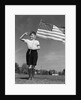1940s Boy Holding American Flag Saluting Wearing Short Pants by Anonymous