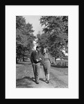 1930s 1940s Young Teen Couple Boy Girl Strolling Down Autumn Country Lane Arm In Arm by Anonymous