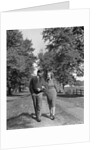 1930s 1940s Young Teen Couple Boy Girl Strolling Down Autumn Country Lane Arm In Arm by Anonymous