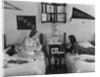 1930s 1940s Two Teen Girls Lying On Dormitory Beds Room Mates Listening To Radio College School Pennants On Wall by Anonymous