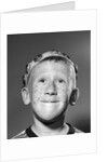 1950s Portrait Of Freckled Teen Boy Wearing Bottle Cap Beanie by Anonymous