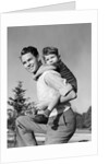 1940s Father Carrying Son Piggyback On Back by Anonymous