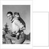 1940s Father Carrying Son Piggyback On Back by Anonymous
