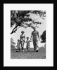 1950s Happy Family Mother Father Daughter Son Walking In Park by Anonymous