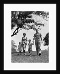 1950s Happy Family Mother Father Daughter Son Walking In Park by Anonymous