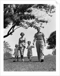 1950s Happy Family Mother Father Daughter Son Walking In Park by Anonymous