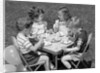 1950s Boys and Girls At Table Eating Cookies and Ice Cream For Birthday Party by Anonymous