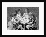 1950s Boys and Girls At Table Eating Cookies and Ice Cream For Birthday Party by Anonymous