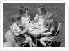1950s Boys and Girls At Table Eating Cookies and Ice Cream For Birthday Party by Anonymous