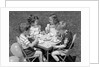 1950s Boys and Girls At Table Eating Cookies and Ice Cream For Birthday Party by Anonymous