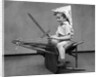1930s Boy Playing Wooden Sword Paper Hat Riding Chair Like A Horse by Anonymous