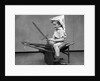 1930s Boy Playing Wooden Sword Paper Hat Riding Chair Like A Horse by Anonymous