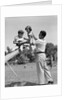 1950s Father Lifting Son And Daughter Onto A Playground Seesaw Outdoor by Anonymous