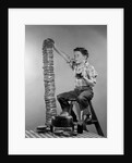 1950s Boy Eating Jelly Toast Sitting On Ladder Stacking Up Tall Pile Of Toast From Toaster by Corbis