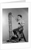 1950s Boy Eating Jelly Toast Sitting On Ladder Stacking Up Tall Pile Of Toast From Toaster by Corbis