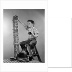 1950s Boy Eating Jelly Toast Sitting On Ladder Stacking Up Tall Pile Of Toast From Toaster by Anonymous