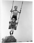 1930s Two Boys Sitting Standing On Playground Swing by Anonymous