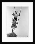 1930s Two Boys Sitting Standing On Playground Swing by Anonymous