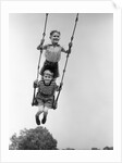 1930s Two Boys Sitting Standing On Playground Swing by Anonymous