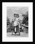1940s Twin Girls Riding Outside On Tricycle by Anonymous