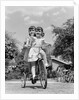 1940s Twin Girls Riding Outside On Tricycle by Anonymous