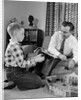 1950s Father And Son Playing With Cowboy Toy Game In Living Room Indoor by Anonymous
