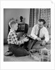 1950s Father And Son Playing With Cowboy Toy Game In Living Room Indoor by Anonymous