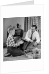 1950s Father And Son Playing With Cowboy Toy Game In Living Room Indoor by Anonymous