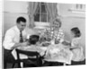 1950s Family Sitting At Kitchen Table Having Breakfast by Anonymous