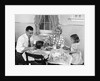 1950s Family Sitting At Kitchen Table Having Breakfast by Anonymous