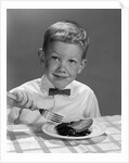 1960s Boy Wearing Bow Tie Eating Pie Dessert With Fork by Anonymous