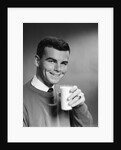 1960s Young Man Holding Glass Of Milk by Anonymous