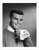 1960s Young Man Holding Glass Of Milk by Anonymous
