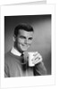 1960s Young Man Holding Glass Of Milk by Anonymous