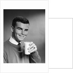 1960s Young Man Holding Glass Of Milk by Anonymous