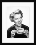 1960s Woman Drinking Coffee Holding Cup And Saucer by Anonymous