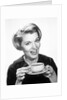 1960s Woman Drinking Coffee Holding Cup And Saucer by Anonymous