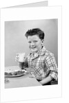 1930s 1940s Freckle-Faced Boy Sitting Dinner Table Holding Glass Milk by Anonymous