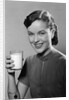 1950s Portrait Woman Holding A Glass Of Milk Studio by Anonymous