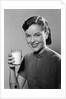 1950s Portrait Woman Holding A Glass Of Milk Studio by Anonymous
