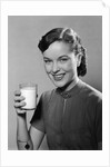 1950s Portrait Woman Holding A Glass Of Milk Studio by Anonymous