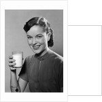 1950s Portrait Woman Holding A Glass Of Milk Studio by Anonymous
